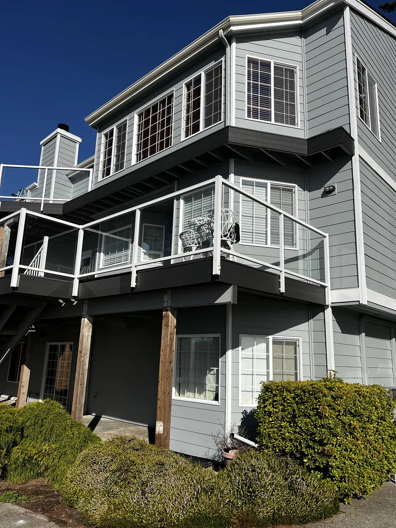 Three-story deck side of a Chuckanut home after exterior painting