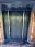 Freshly sprayed blue front door with the glass and surroundings still masked