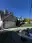 Garage door masked and prepped with the paint sprayer set up on a protected driveway on Chuckanut Drive