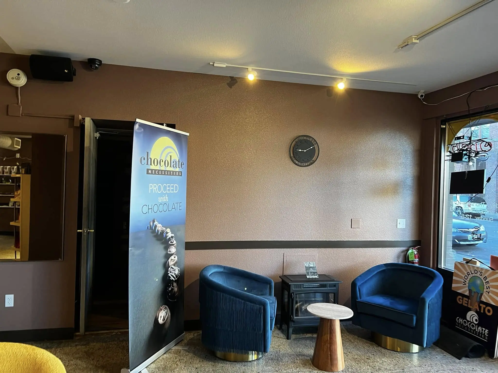 Downtown Bellingham storefront interior repainted in Benjamin Moore Aura with a metallic accent wall
