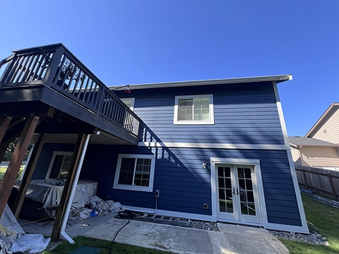 Front of a Whatcom Falls home after exterior repaint — siding and trim restored.