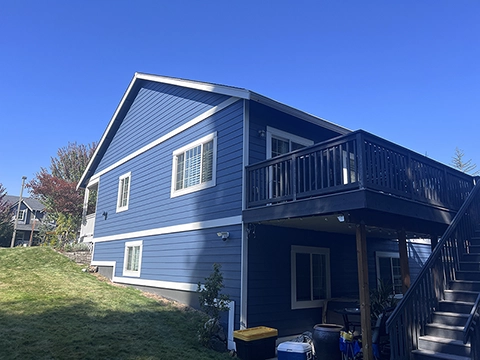 Rear exterior of Whatcom Falls home after repaint — siding and trim completed.