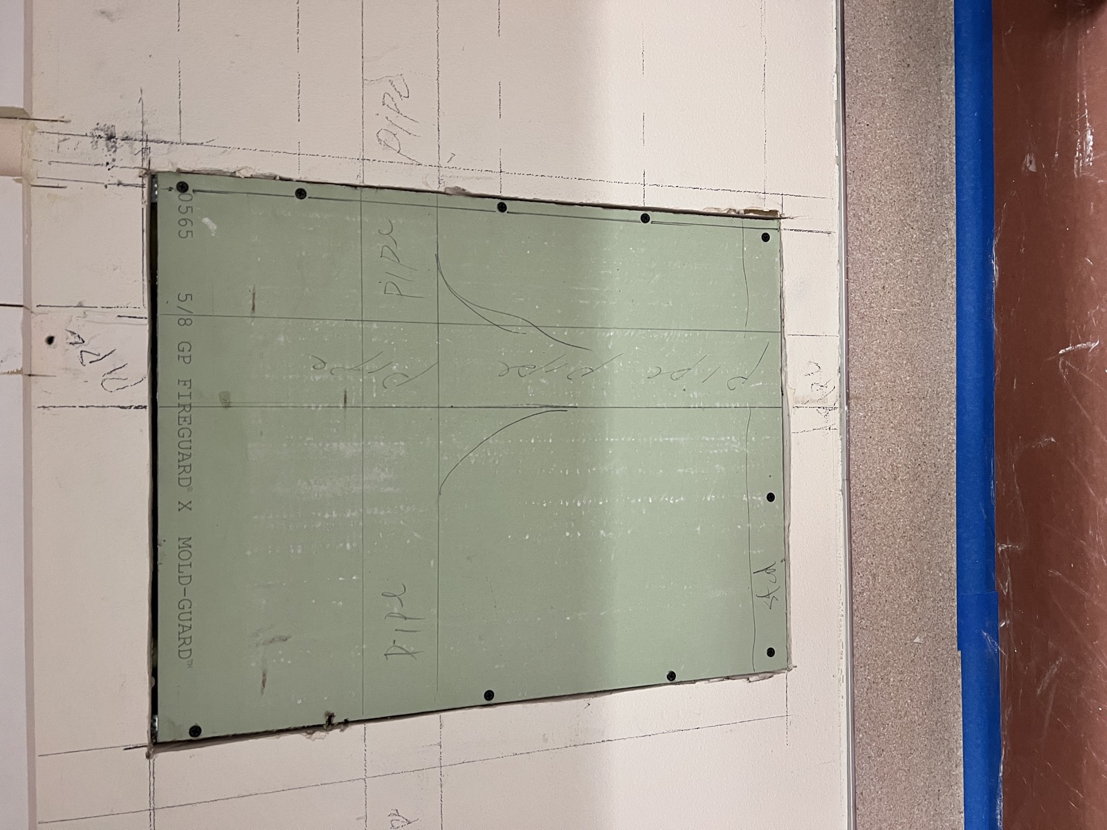 Drywall patch meticulously taped, mudded, and textured to match the surrounding wall